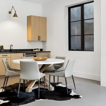 Designer reviewing custom home bar cabinet plans