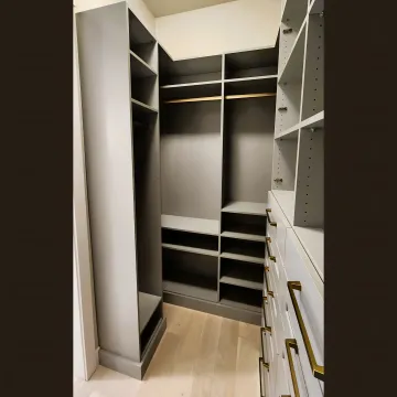 Cabinet installer measuring custom kitchen cabinetry