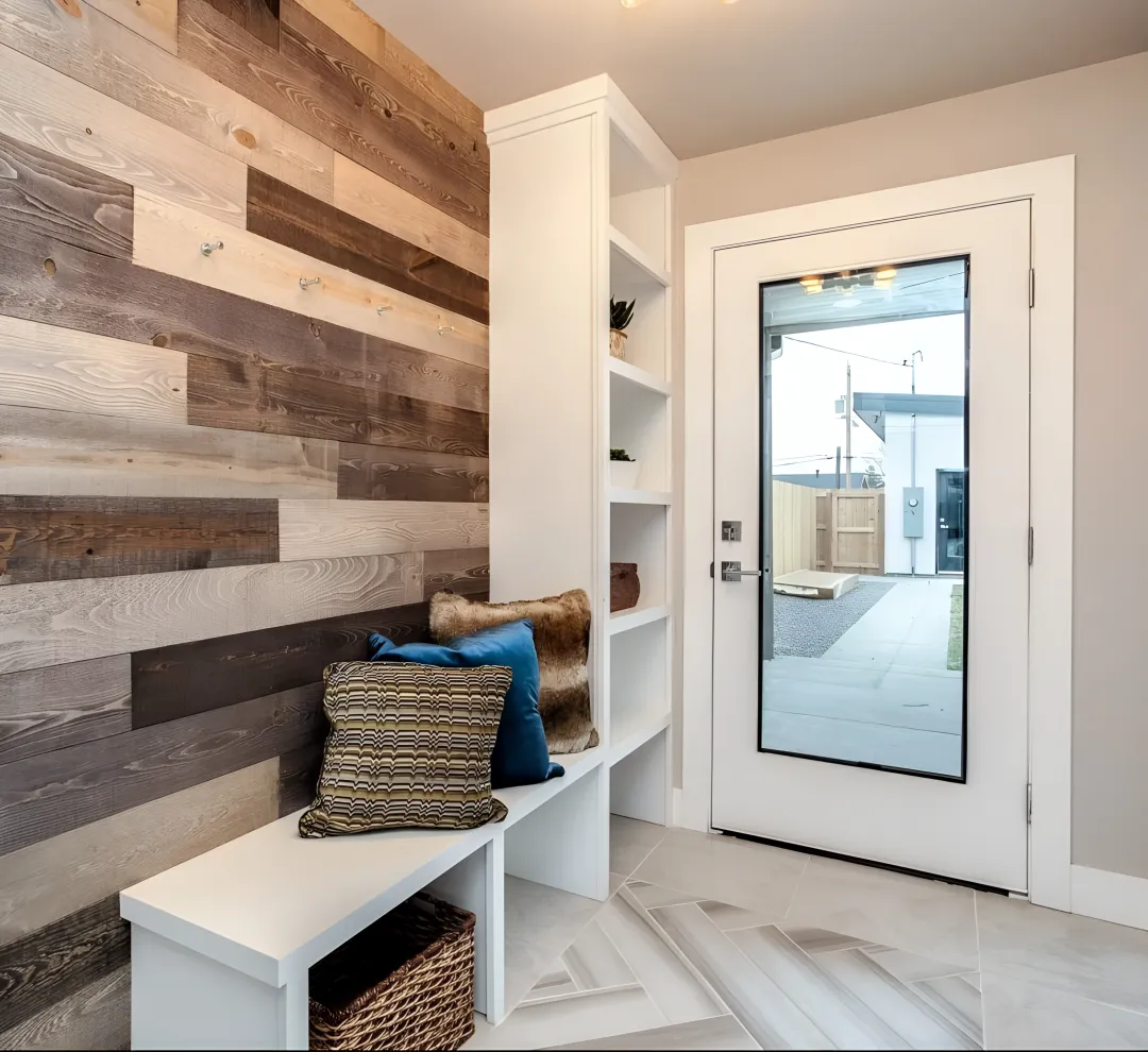 Custom L-shaped mudroom locker cabinets with bench and cubbies
