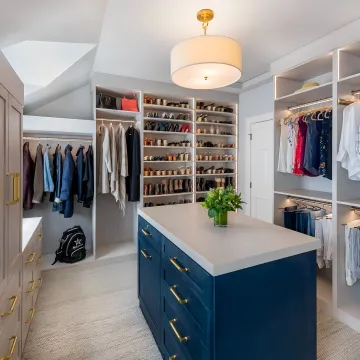 Custom laundry room with cabinets and folding counter
