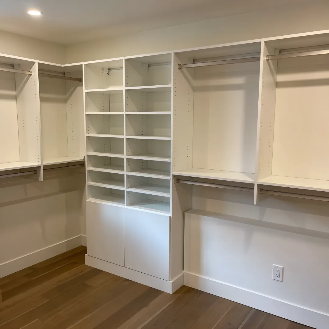 Designer reviewing laundry room cabinet plans