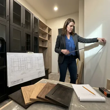Designer measuring a custom closet space