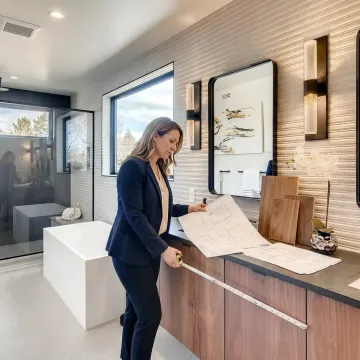Cabinet designer reviewing bathroom vanity plans
