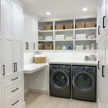 Custom remodeled laundry room with cabinets