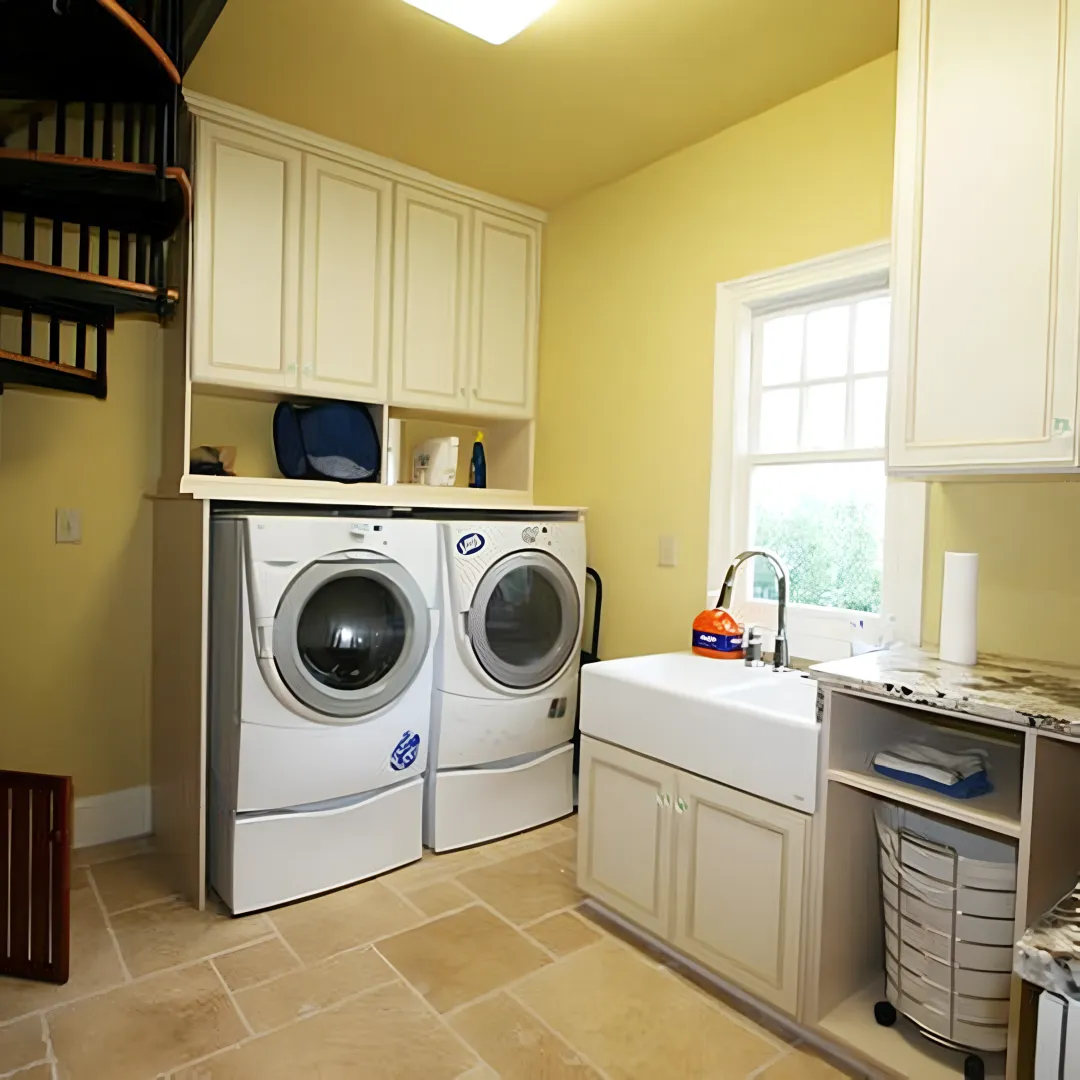 Cabinet installer fitting custom laundry room storage