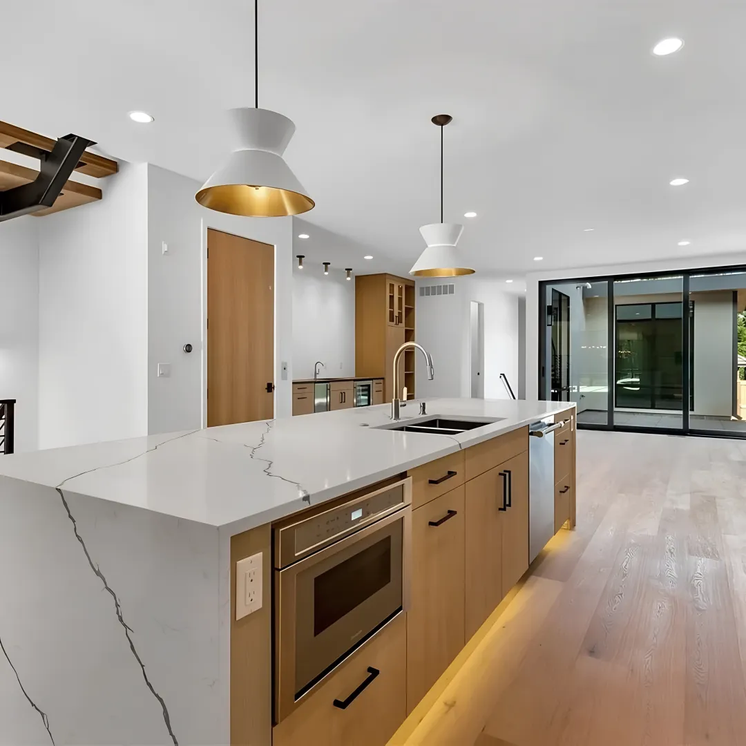 Designer reviewing custom cabinet plans with homeowners