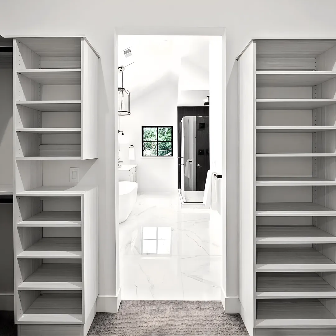 Custom walk-in closet with wood cabinetry and lighting