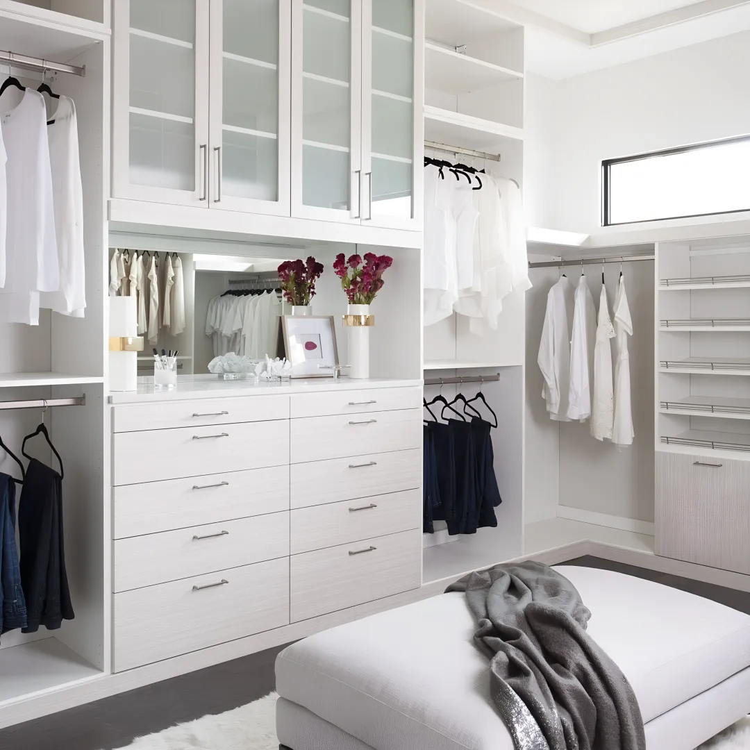 Designer measuring a closet for custom storage