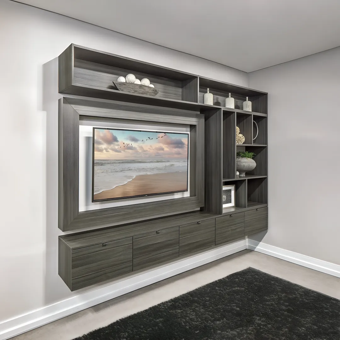 Cabinet installer mounting a floating TV cabinet