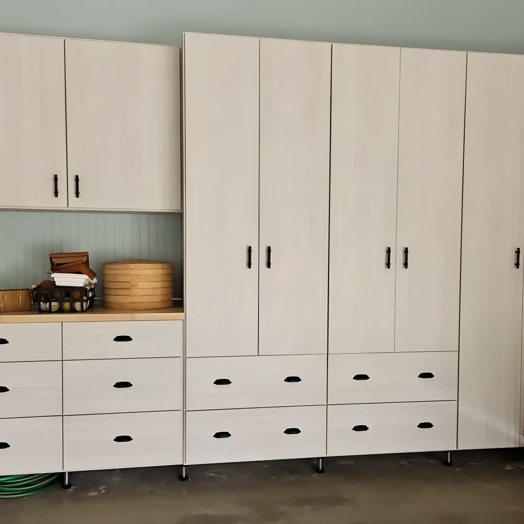 Designer measuring garage for custom cabinets