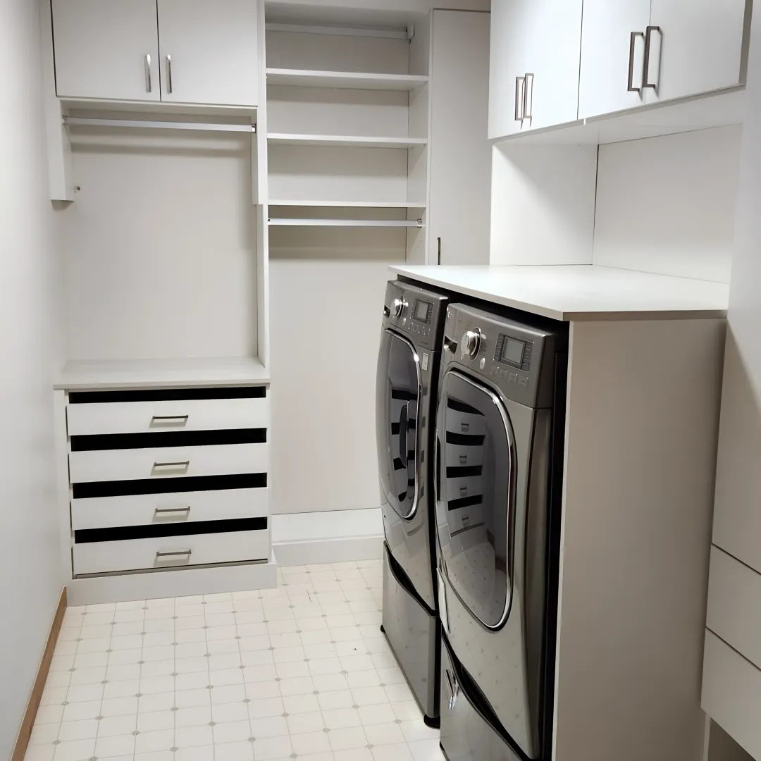 Custom remodeled laundry room with cabinets