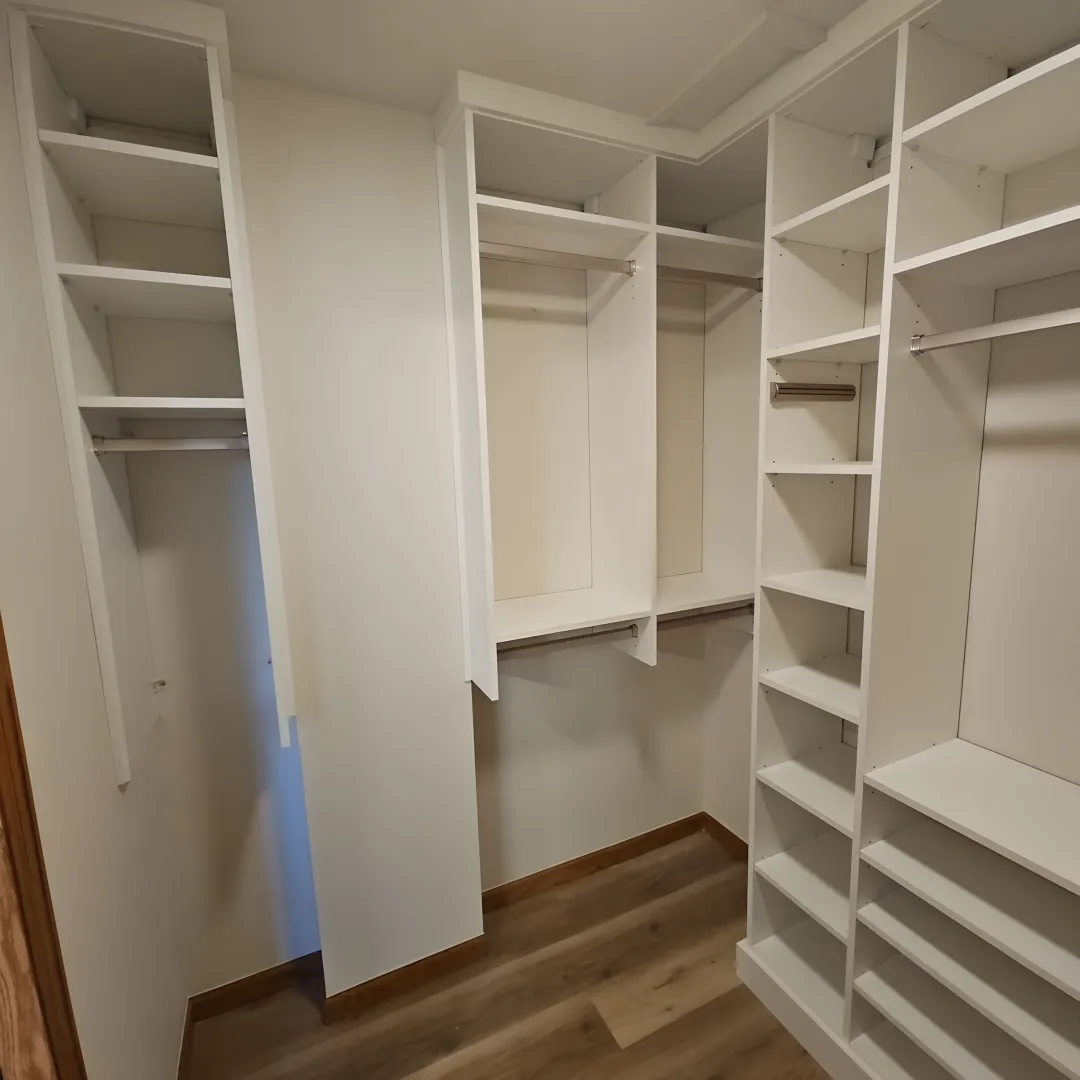 Designer reviewing custom walk-in closet plans