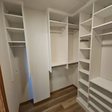 Designer reviewing custom walk-in closet plans