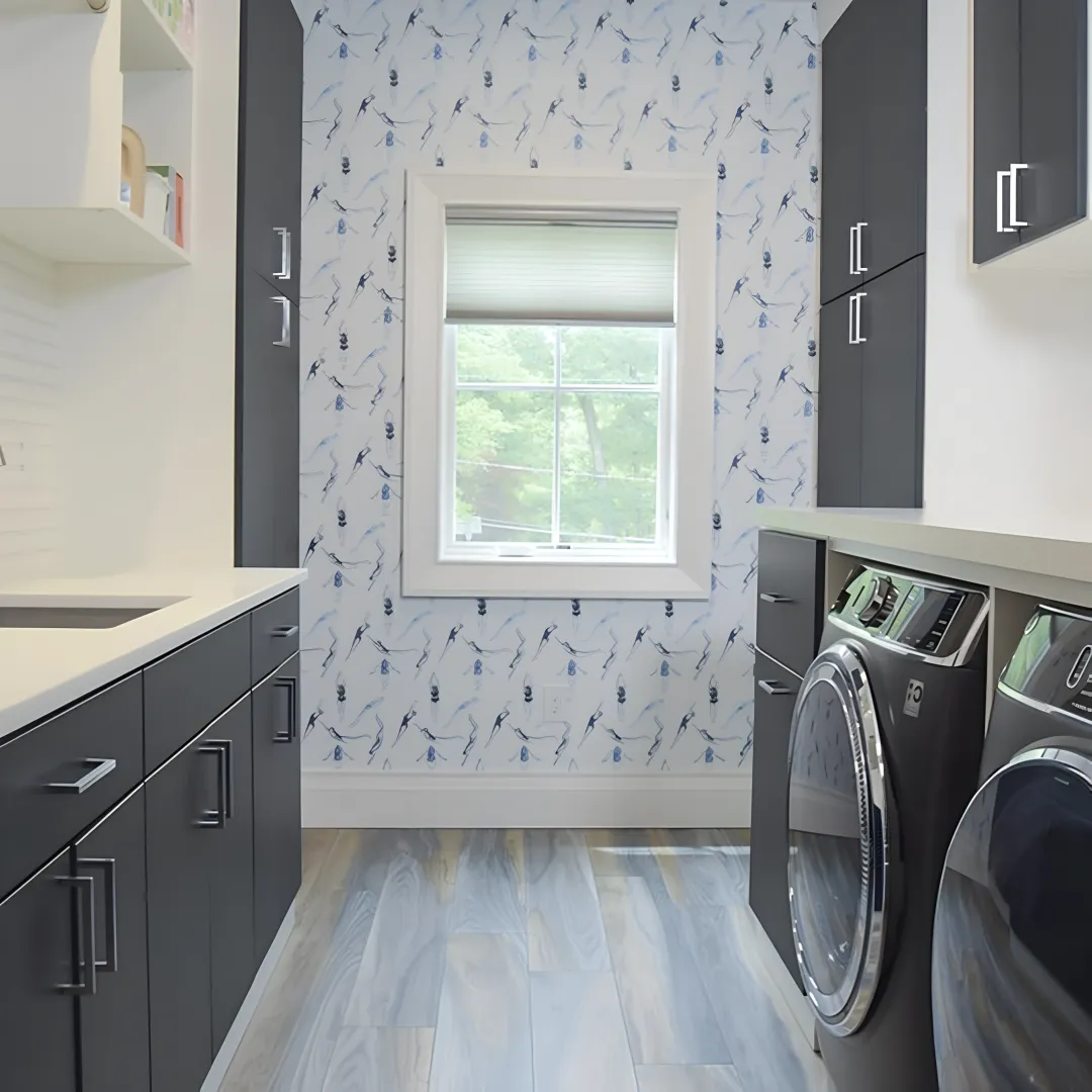 Designer reviewing laundry room cabinet plans