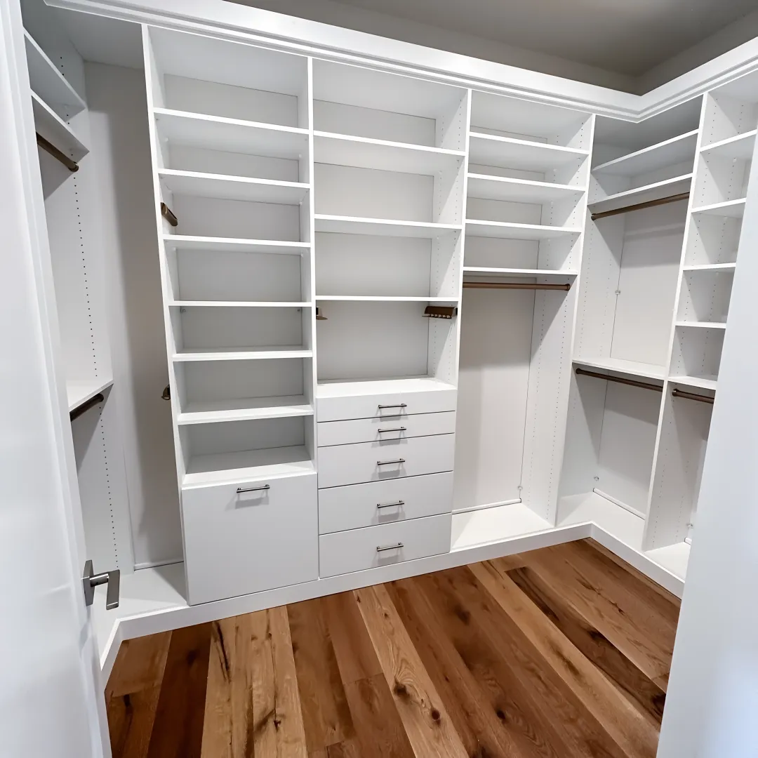 Designer reviewing a custom walk-in closet plan