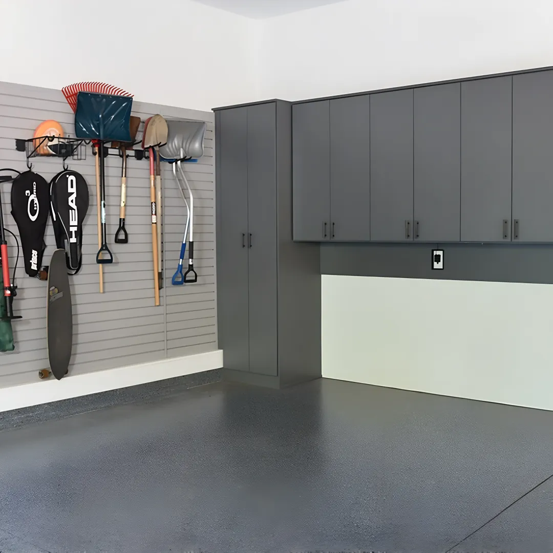 Designer measuring garage for custom cabinets
