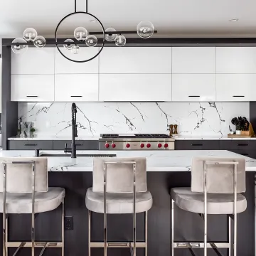 Designer reviewing luxury kitchen cabinet plans