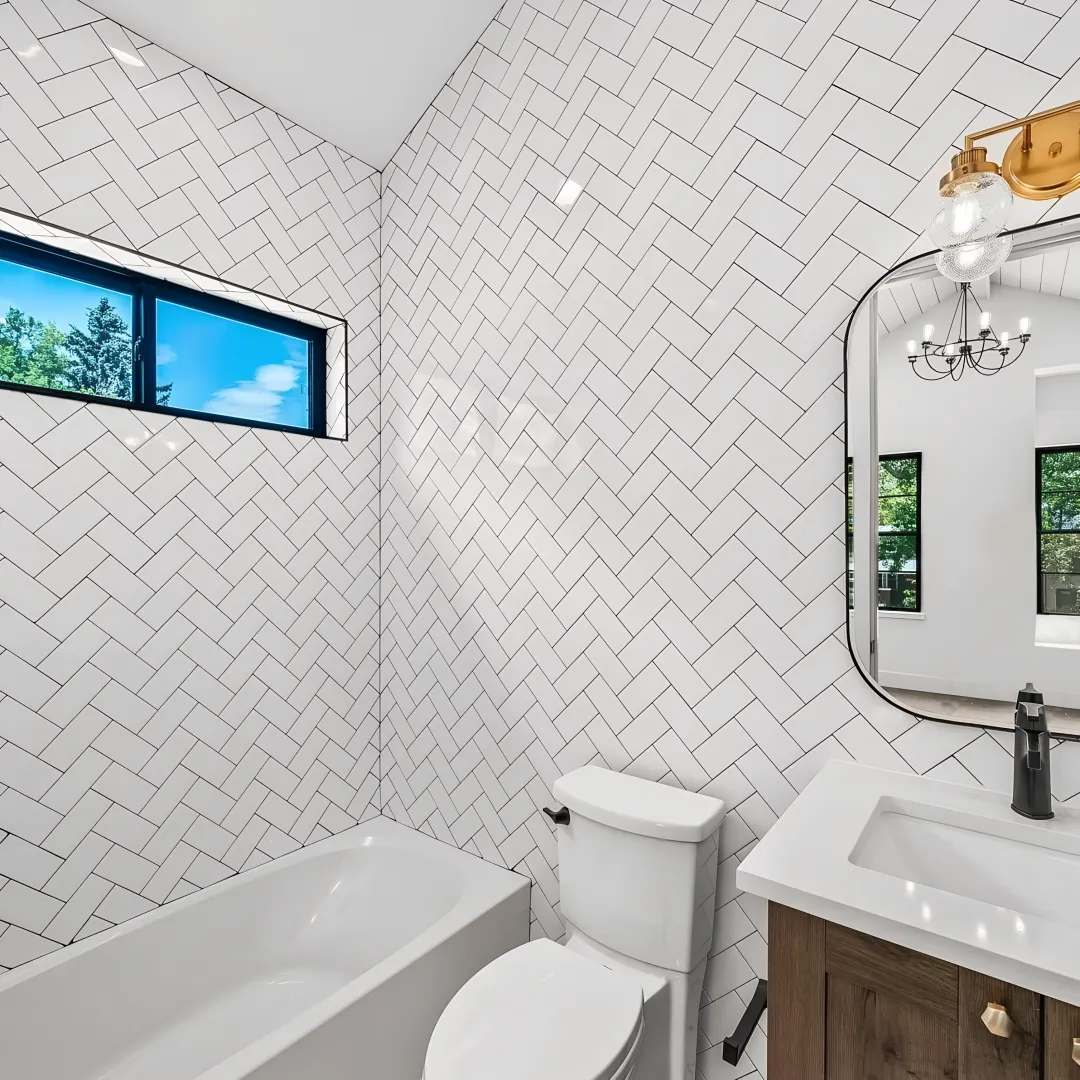 Designer reviewing bathroom cabinet plans with homeowner