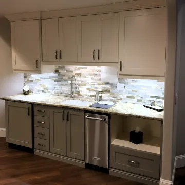 Cabinet designer reviewing custom plans in a home
