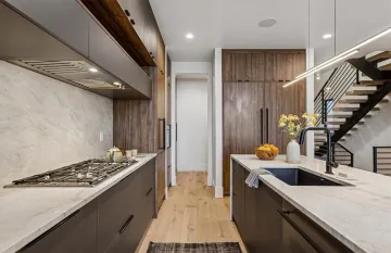 Cabinet designer reviewing custom kitchen plans