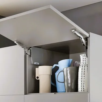 Cabinet designer reviewing lift mechanism plans