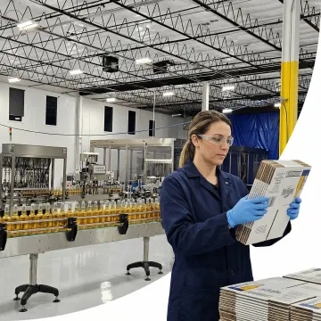 Technician inspecting beverage secondary packaging on automated production line
