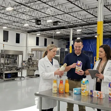 Co-manufacturing team reviewing creamer product formulations and packaging designs