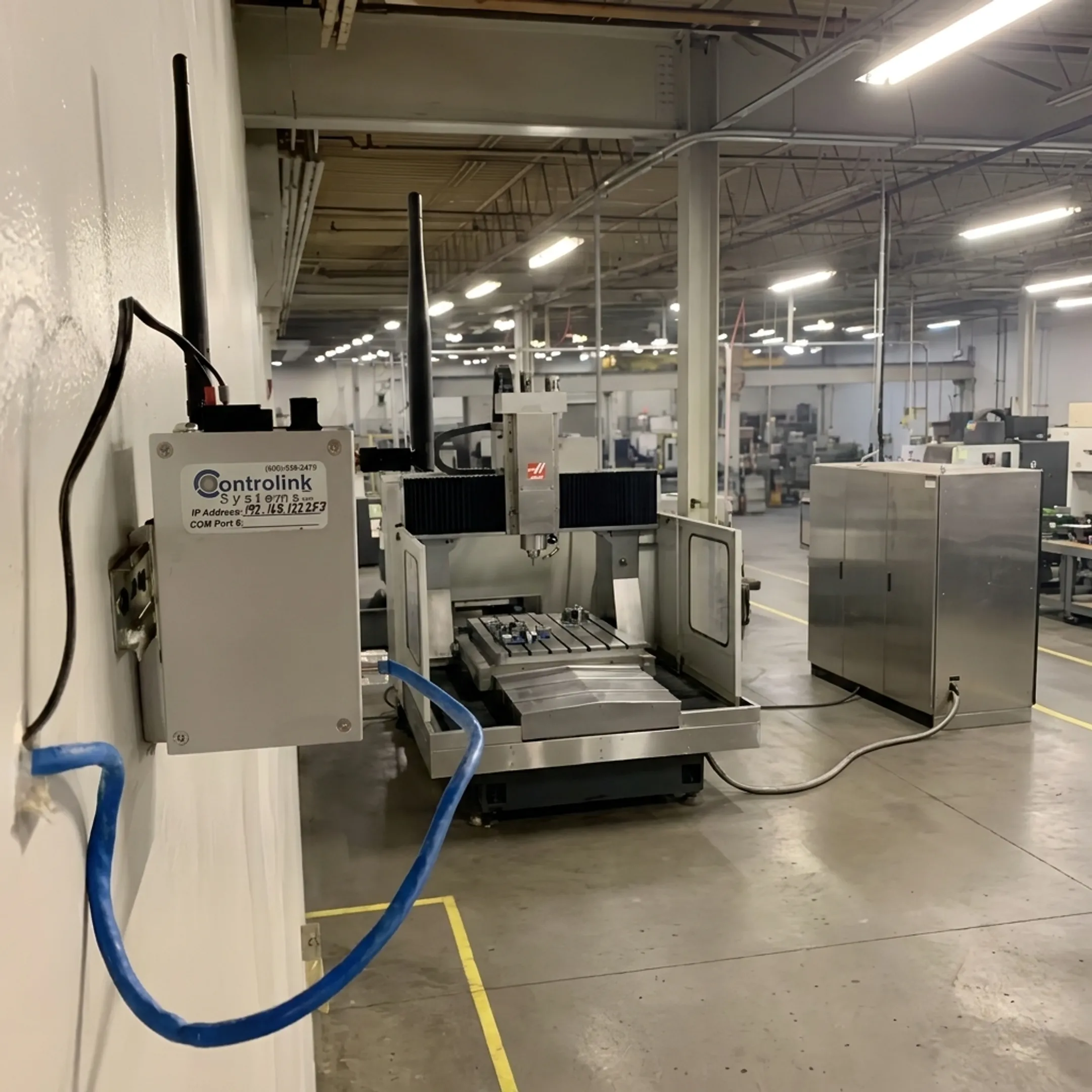 Industrial CNC milling center operating with connected DNC system