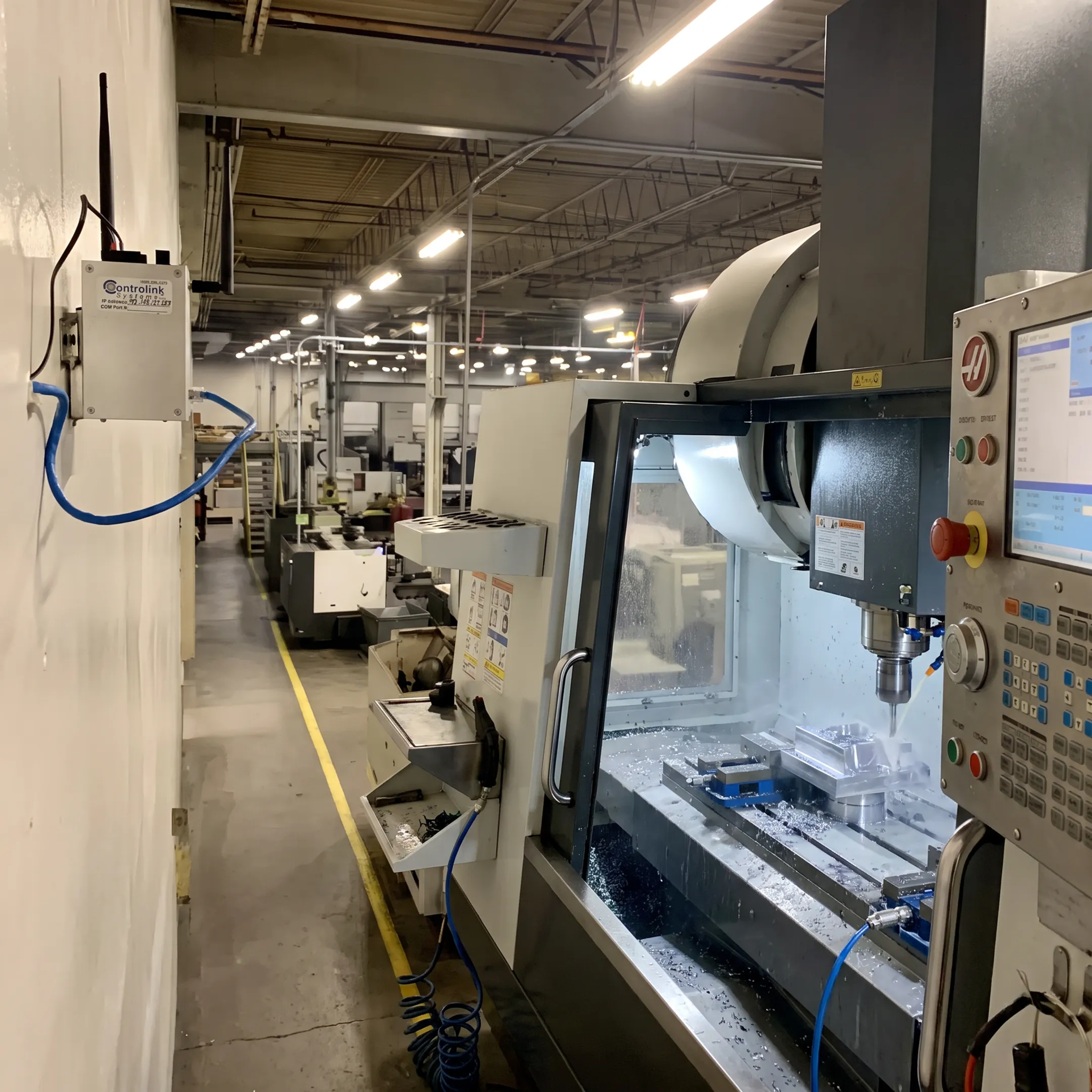 CNC machining center operating with automated program delivery interface