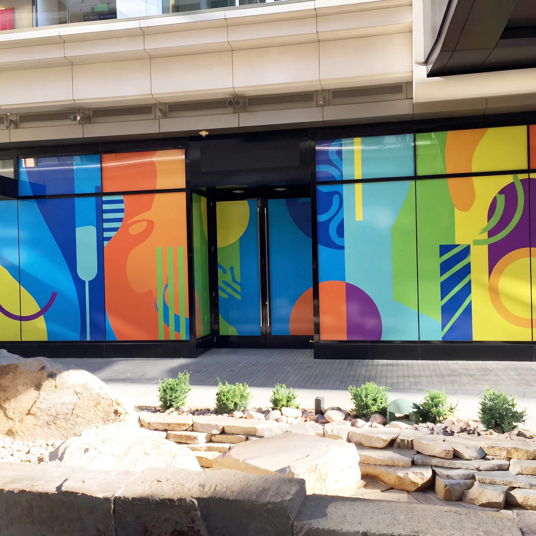 Custom commercial window graphics installed on office glass