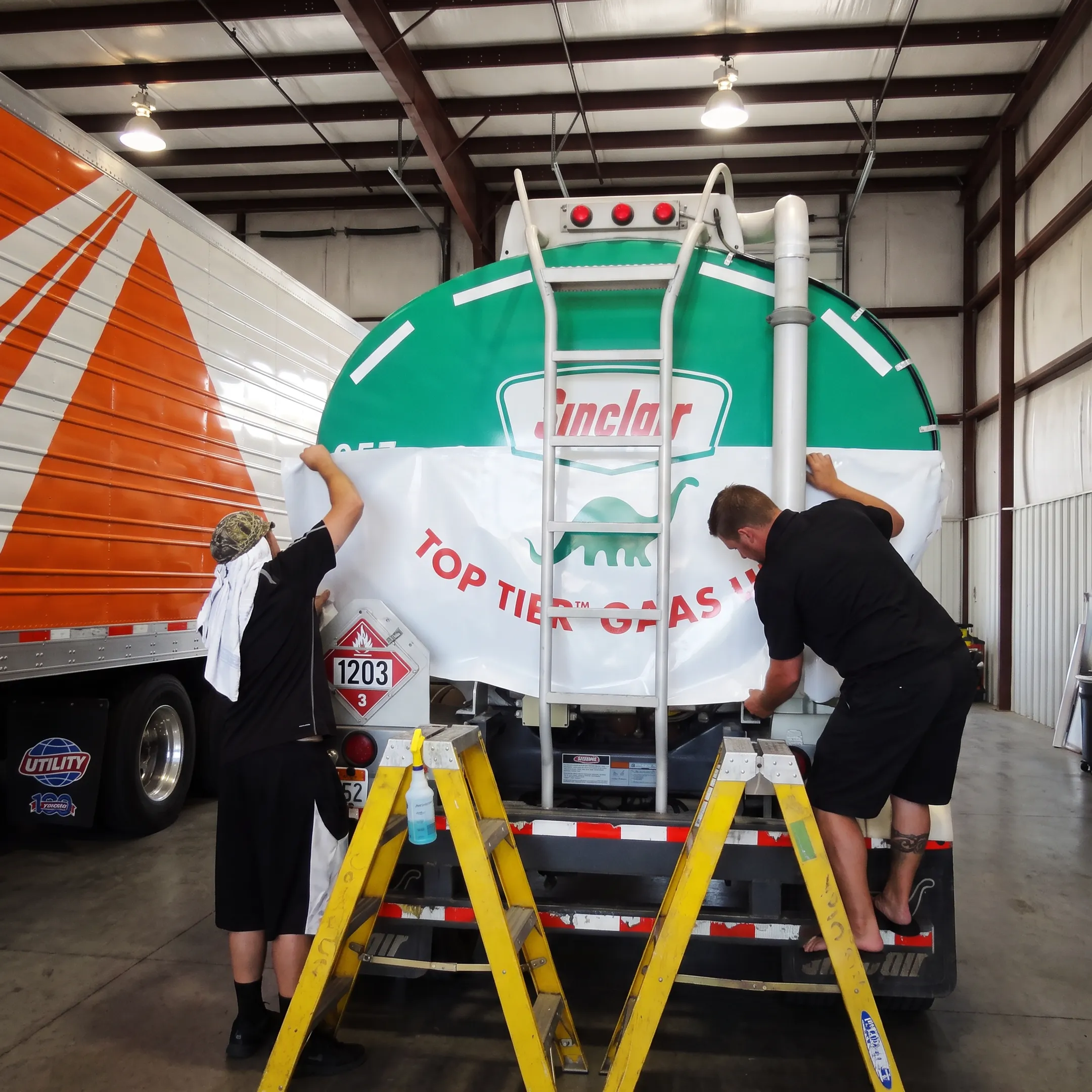 Branded commercial fleet vehicle receiving professional graphics installation