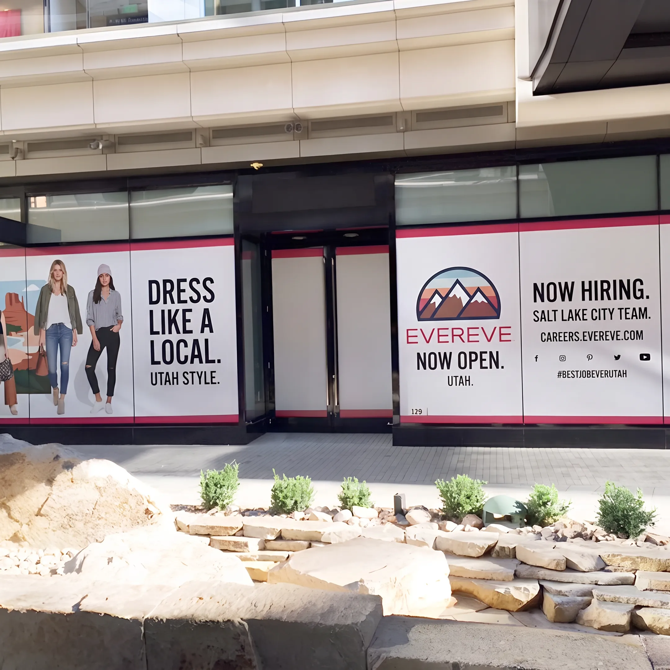 Retail branding graphics installed across windows and interior walls