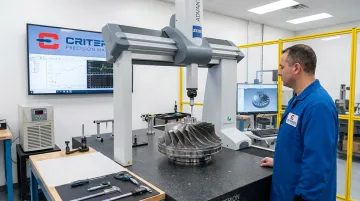 CMM coordinate measuring machine inspecting precision aerospace satellite component dimensions
