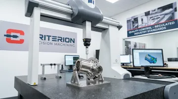 CMM coordinate measuring machine inspecting precision machined stainless steel component