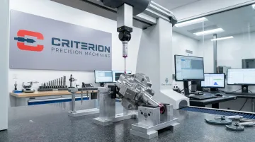 Precision CMM inspection system measuring complex surface geometry on machined part