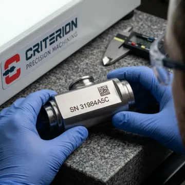Fiber laser marking a defense component