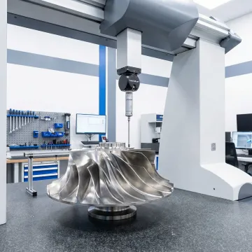 Precision machined aerospace component being inspected on coordinate measuring machine