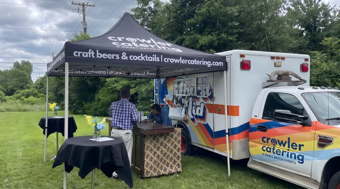 Crowler Catering Thirst Aid mobile bar ambulance with six tap handles serving craft cocktails at Louisville holiday event