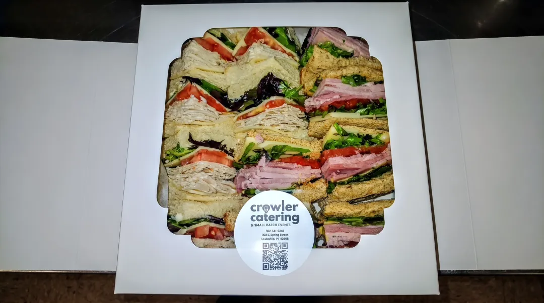 Crowler Catering boxed lunch display showing labeled dietary accommodation options for corporate delivery