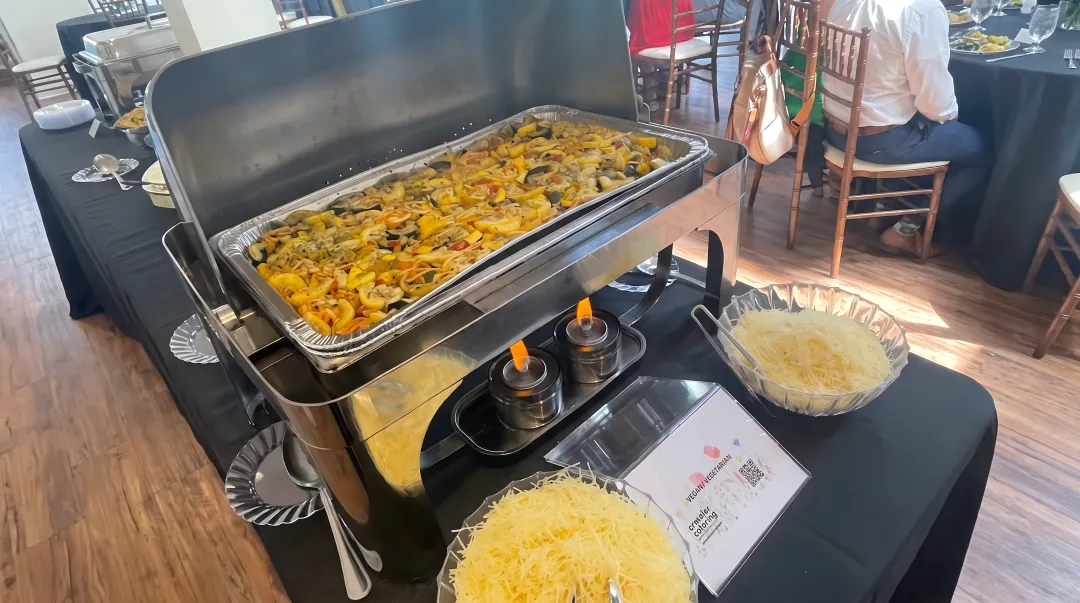 Corporate office lunch buffet setup with organized food stations and traffic flow