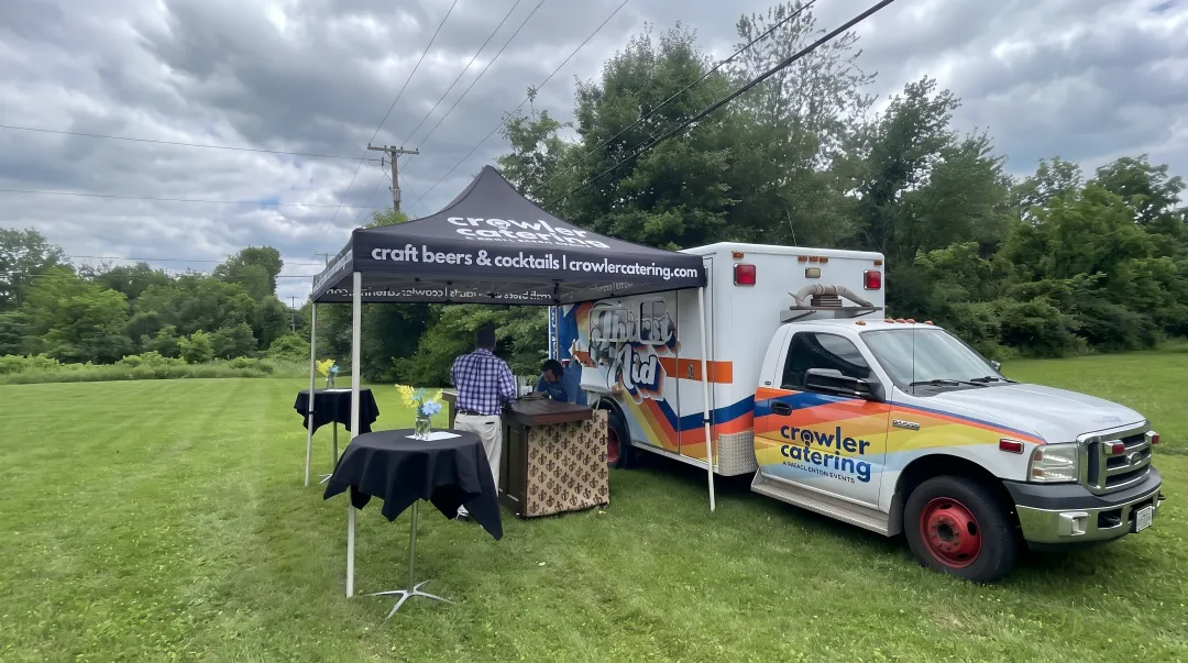 Thirst Aid mobile bar ambulance with six taps serving craft cocktails at outdoor Louisville event