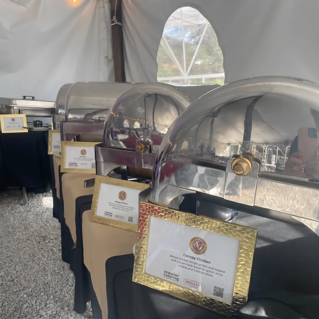 Caterer arranging fresh food and drinks for guests