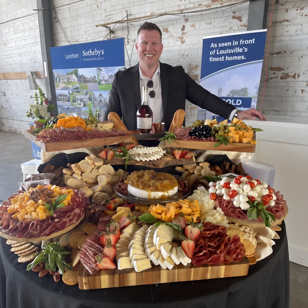 Caterer arranging an event menu spread