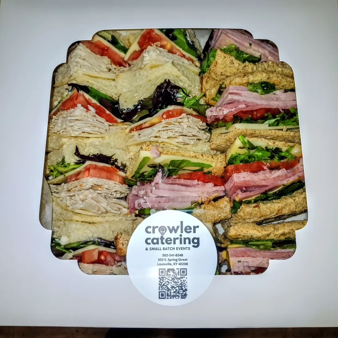 Catering staff preparing office lunch delivery