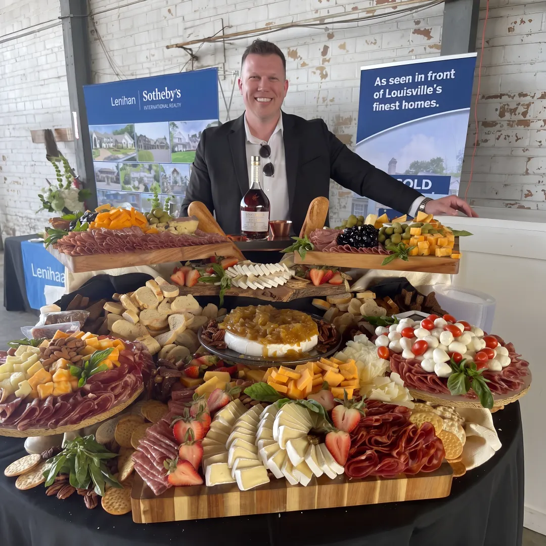 Caterer arranging a wedding grazing table