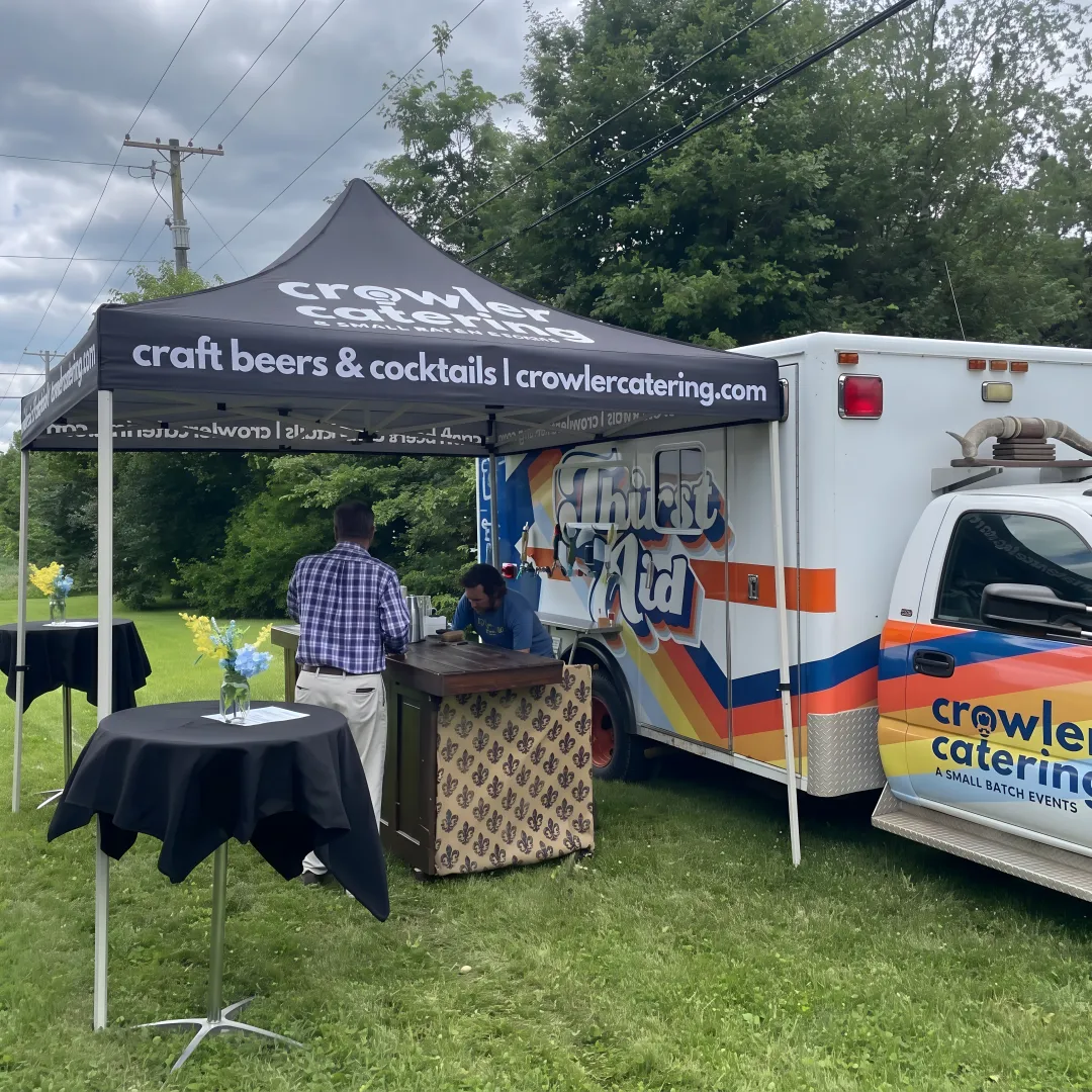 Bartender serving cocktails from a wedding mobile bar