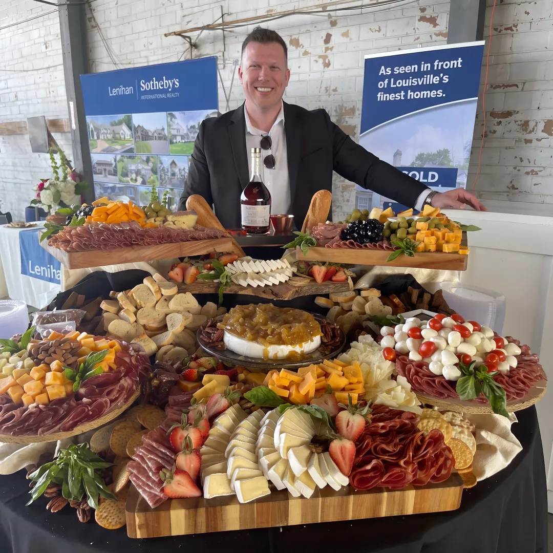 Guests enjoying catered food and cocktails at an event