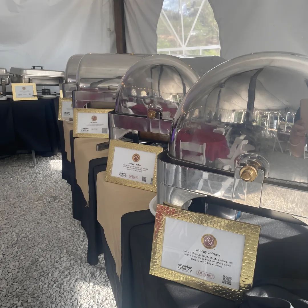 Catering team arranging a gourmet event buffet