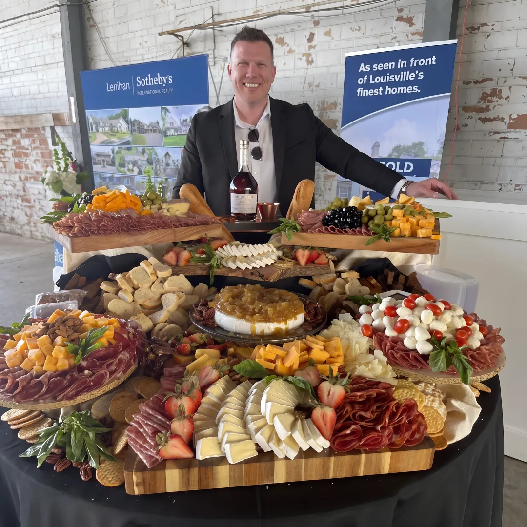 Catered charcuterie board with meats, cheeses, and fruit