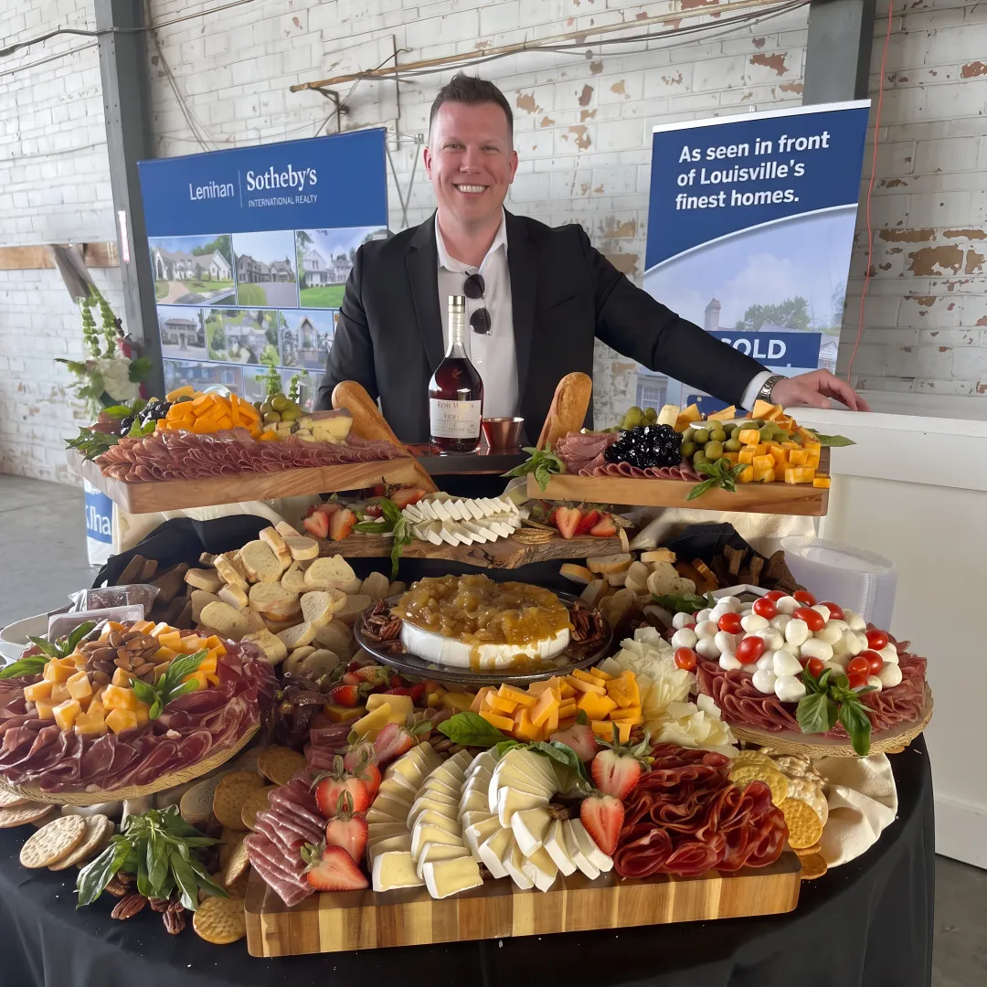 Catered canapé display with charcuterie and cocktails